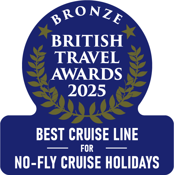 A blue and gold badge reading Bronze British Travel Awards 2025. Best Cruise Line for No-Fly Cruise Holidays, surrounded by laurel branches.