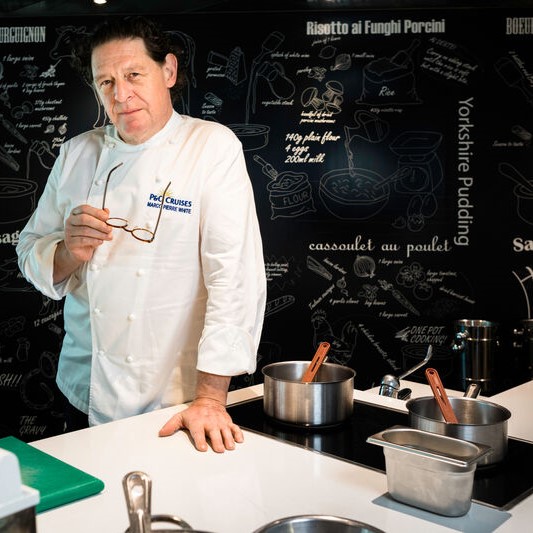 Chef Marco Pierre White in the Cookery Club on board Britannia, demonstrating culinary career opportunities and onboard hospitality roles.